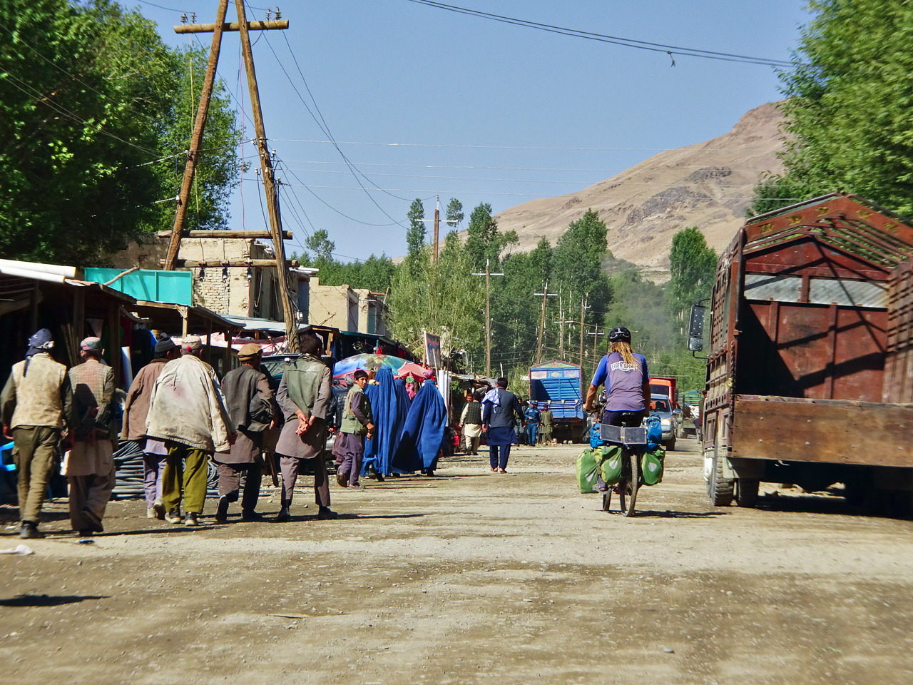 Cycling through the bazar in Ishkashim