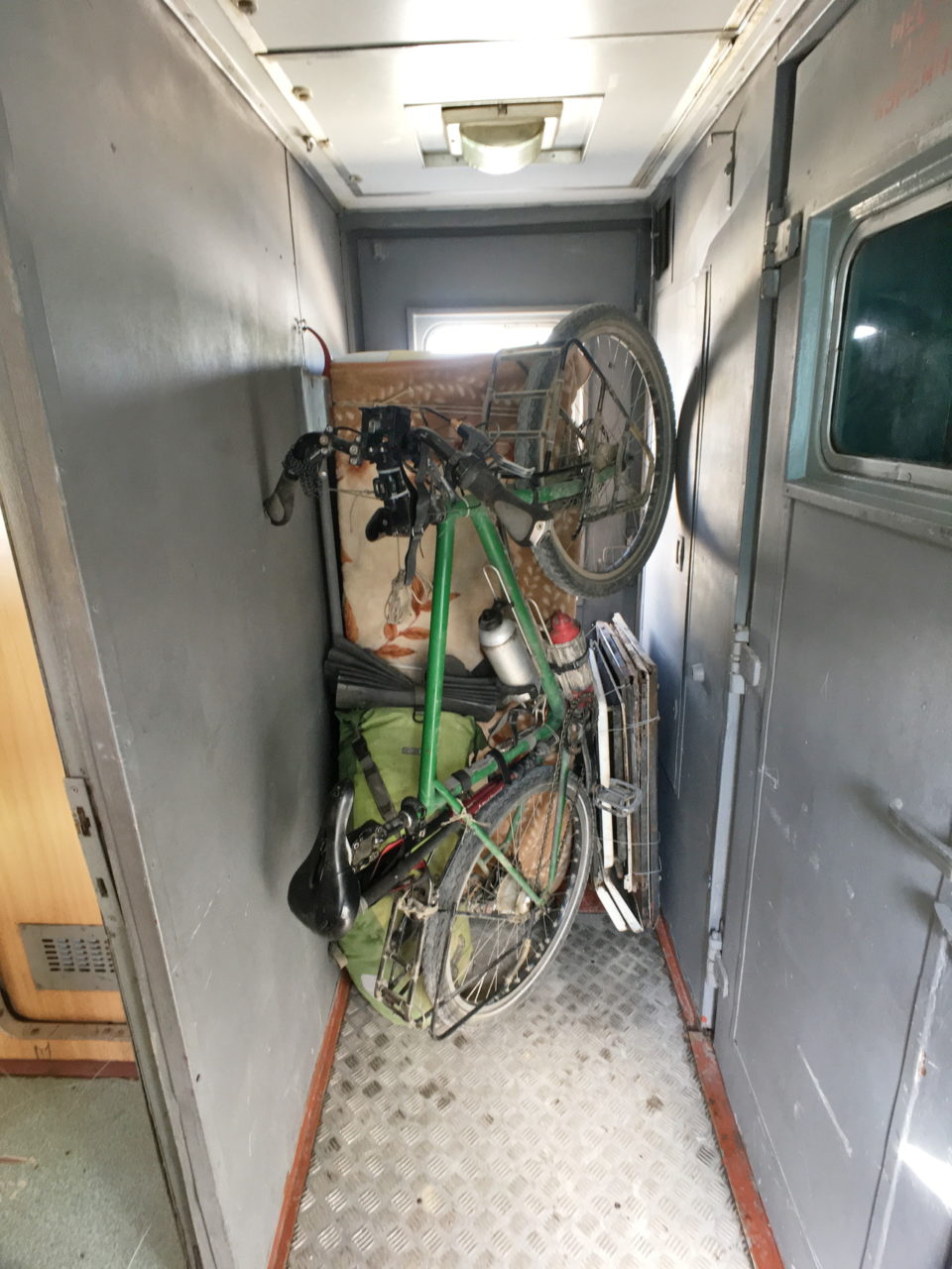 Bicycle and fridge in a train